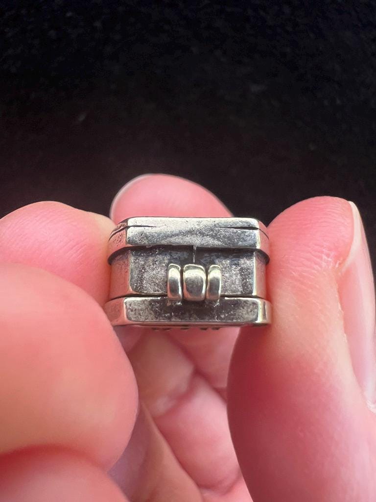 Tiny Dzambhala Ghau Pendant | Metal and Glass | Approx 3/4in x 1/2in | Tibet | Gau - The Incense Stick