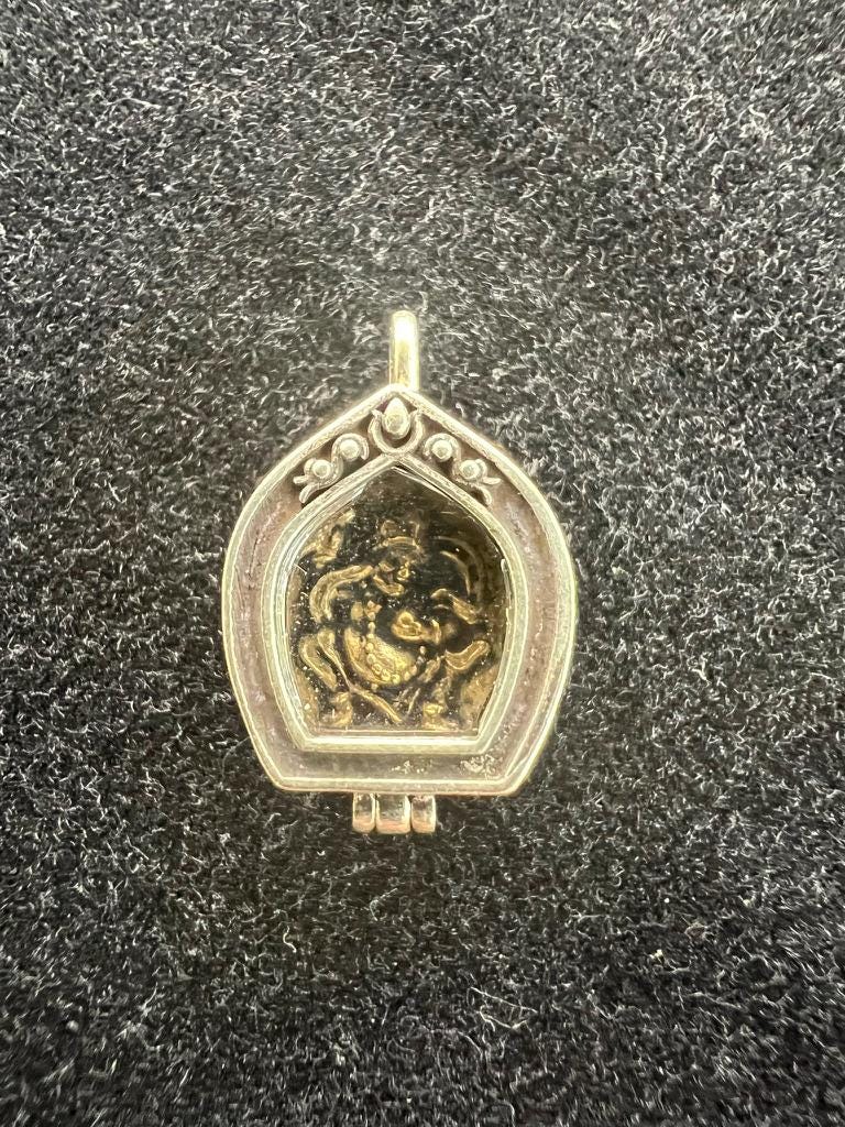 Tiny Dzambhala Ghau Pendant | Metal and Glass | Approx 3/4in x 1/2in | Tibet | Gau - The Incense Stick