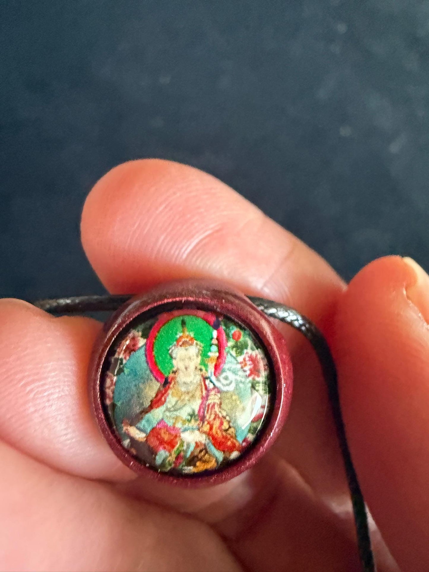 round bead pendant of a Guru Rinpoche thangka