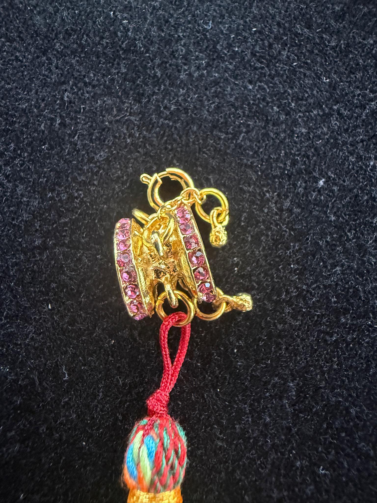 Damaru Pendant | Metal, Rhinestones | Approx 3/8in x 1/2in | Tibet | Tibetan Drum