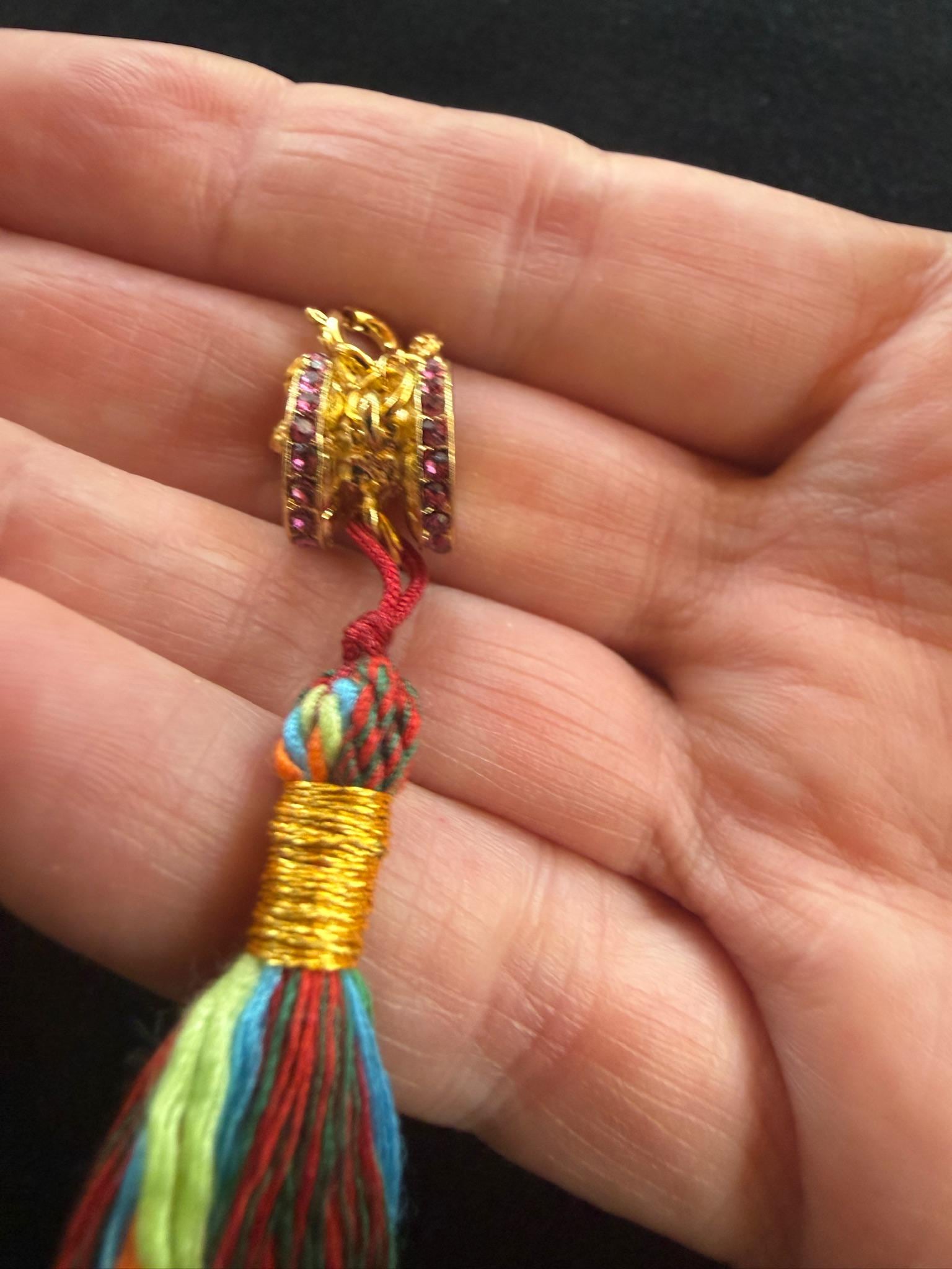 Damaru Pendant | Metal, Rhinestones | Approx 3/8in x 1/2in | Tibet | Tibetan Drum